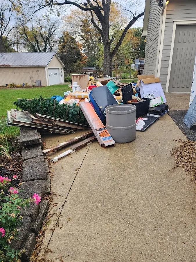 Dumpster being loaded with debris for Demolition Dumpster Rental in Sioux Center